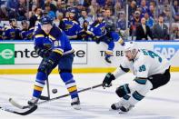 May 21, 2019; St. Louis, MO, USA; St. Louis Blues right wing Vladimir Tarasenko (91) passes the puck while defended by San Jose Sharks center Logan Couture (39) during the second period in game six of the Western Conference Final of the 2019 Stanley Cup Playoffs at Enterprise Center. Mandatory Credit: Jeff Curry-USA TODAY Sports