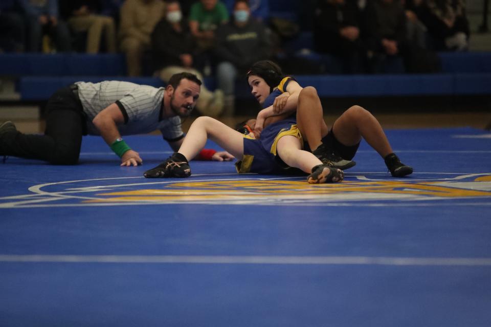 Eva Hinkle looks toward the Aberdeen Central bench as she attempts to pin Huron's Chaile Sah. Hinkle won via pinfall in 1:20 in the first period earlier this season.