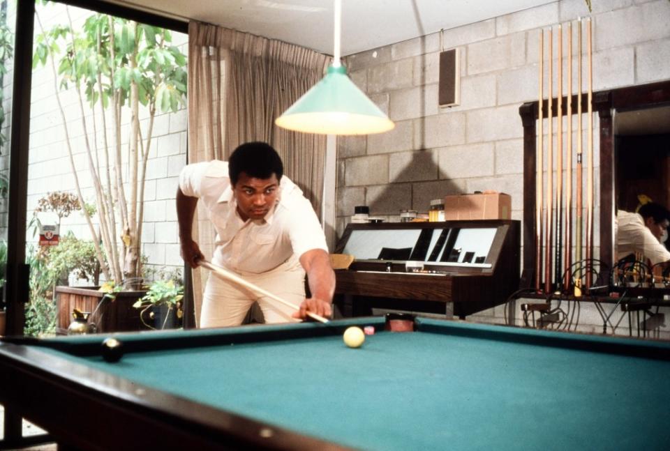 Muhammad Ali at his home playing pool. Getty Images