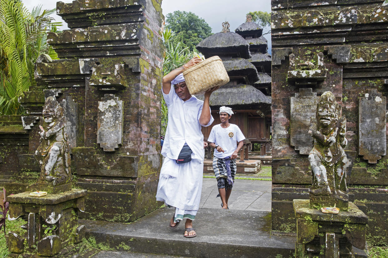 Pilgrims visiting Pura Luhur Batukaru, a Hindu temple in Bali, Indonesia. (Photo: Arterra via Getty Images)