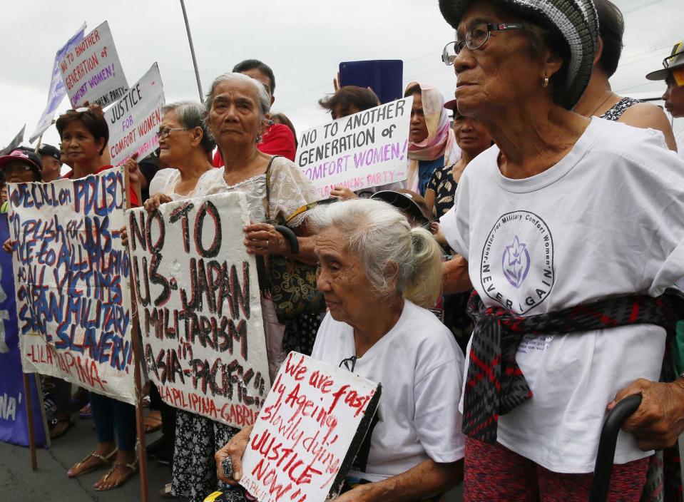 Alleged Filipino "comfort women" and their supporters gather for a rally outside the Japanese Embassy to protest the two-day visit of Japanese Prime Minister Shinzo Abe, Thursday, Jan. 12, 2017 in suburban Pasay city south of Manila, Philippines. The "comfort women," alleged forced by Japanese forces to be sex slaves during WWII, are calling on President Rodrigo Duterte to bring up their plight in his meeting with Prime Minister Abe.(AP Photo/Bullit Marquez)