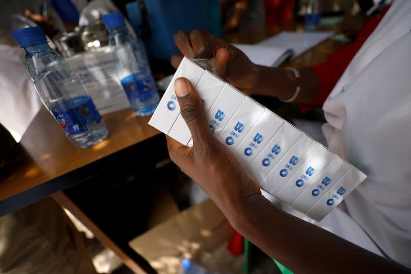 A health worker prepares doses of coronavirus disease (COVID-19) vaccine in Dakar