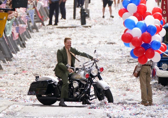 A body double for Boyd Holbrook is seen on motorbike during a parade scene on St Vincent Street in Glasgow city centre during filming for what is thought to be the new Indiana Jones 5 movie starring Harrison Ford