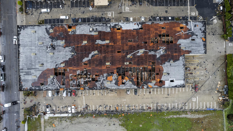 Damage to a building is seen on Wednesday, March 22, 2023 in Montebello, Calif., after a possible tornado. (AP Photo/Ringo H.W. Chiu)