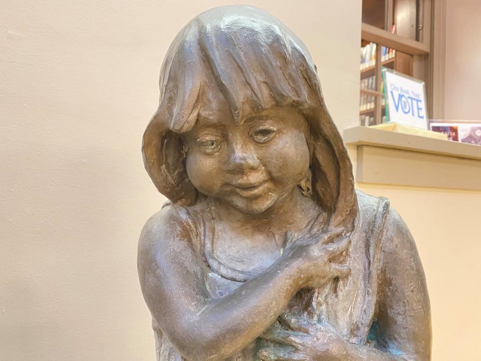 A look at Lorann Jacobs’ sculpture of a little girl close up shows her smile. York Rotary donated the sculpture in 2005.