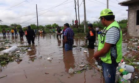 Government officials tour an area flooded by the rains of Tropical Storm Beatriz in Juchitan, in Oaxaca state, Mexico, June 2, 2017. REUTERS/Rusvel Rasgado