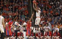 Syracuse's C.J. Fair (5) shoots over Dayton's Jordan Sibert (24) during the first half of a third-round game in the NCAA men's college basketball tournament in Buffalo, N.Y., Saturday, March 22, 2014. (AP Photo/Bill Wippert)