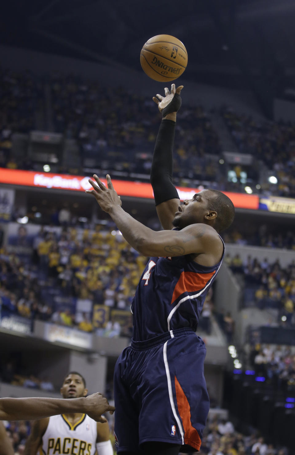 Atlanta Hawks' Paul Millsap puts up a shot during the first half in Game 2 of an opening-round NBA basketball playoff series against the Indiana Pacers Tuesday, April 22, 2014, in Indianapolis. (AP Photo/Darron Cummings)