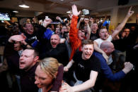 Britain Football Soccer - Leicester City fans watch the Chelsea v Tottenham Hotspur game in pub in Leicester - 2/5/16. Leicester City fans celebrate Chelsea's second goal. Reuters / Eddie Keogh Livepic