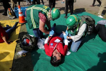 First responders practice earthquake triage during the annual California ShakeOut in Los Angeles, California, U.S. October 19, 2017. REUTERS/Lucy Nicholson