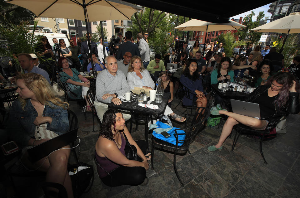 <p>Bill Daggett, center left, and his wife Kathy Daggett, center, right, watch a live television broadcast of former FBI director James Comey testifying before the Senate Select Committee on Intelligence, on Capitol Hill, with a group of other people at Shaw’s Tavern in Washington, June 8, 2017. (Manuel Balce Ceneta/AP) </p>