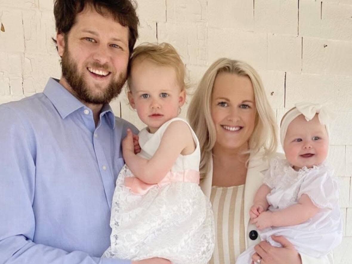 Mallori Onderwater, her husband Chris, and their two daughters returned home Monday morning after a forest fire forced them from their home in Middle Sackville the night before. (Submitted by Mallori Onderwater - image credit)