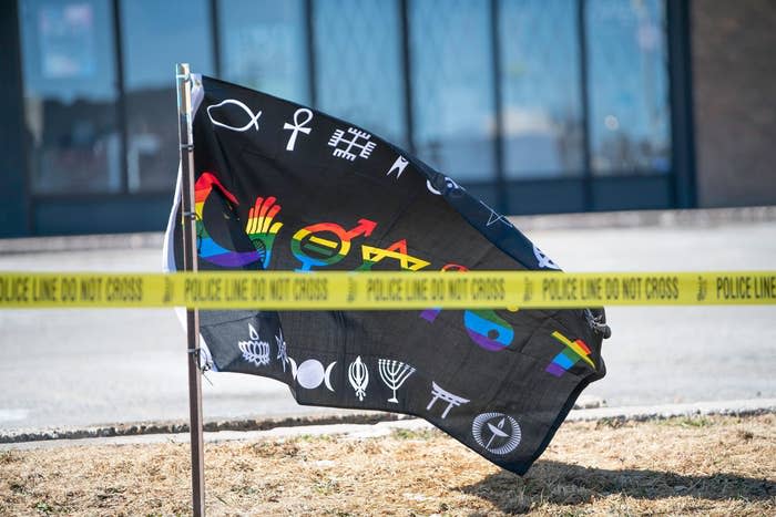 An inclusion flag at a makeshift memorial the morning after the Club Q mass shooting in Colorado Springs, Colorado.