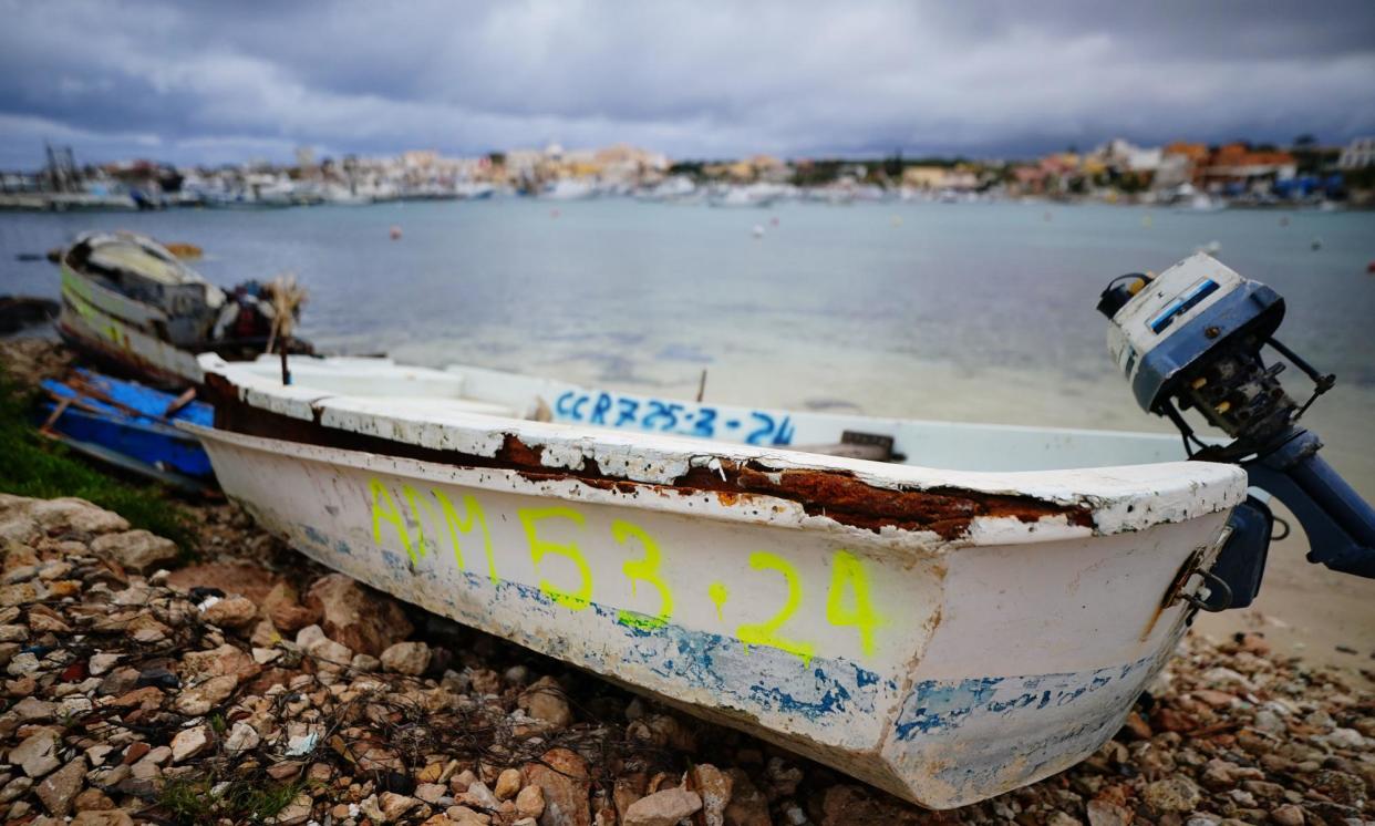 <span>A discarded migrant vessel marked with the date on which it arrived on a beach in Lampedusa.</span><span>Photograph: Victoria Jones/PA</span>
