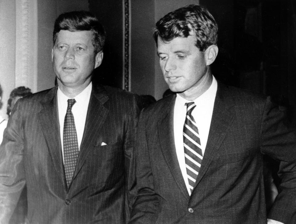 Massachusetts Sen. John F. Kennedy, left, and his brother and campaign manager, Robert Kennedy, are shown together on July 10, 1960 in an unknown location. The Senator is seeking the Democratic presidential nomination. (AP Photo)