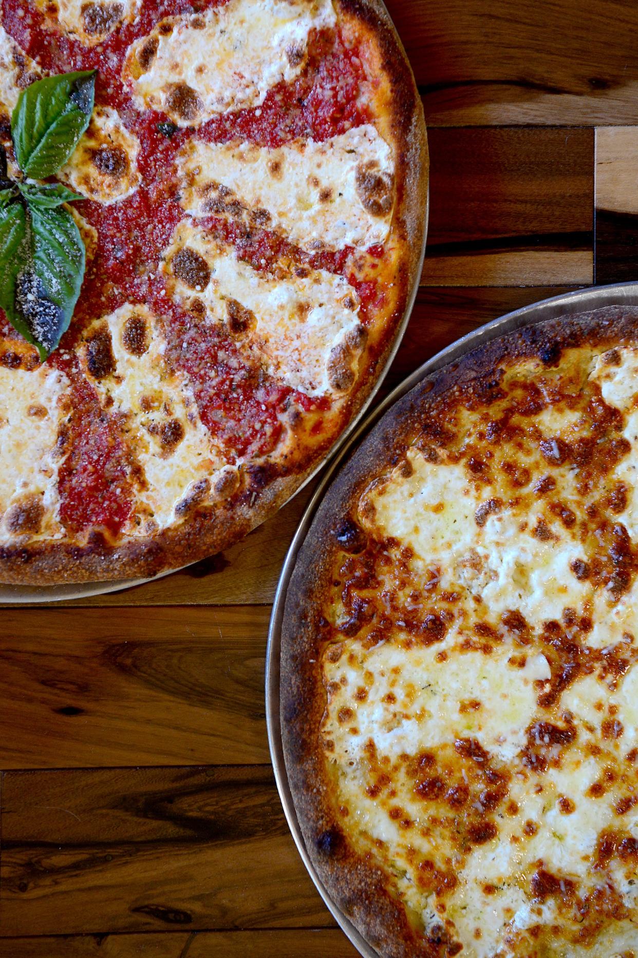 The Classic Margherita, left, and the special White are two of the many options at Fahrenheit Pizza and Brewhouse in Arden. 