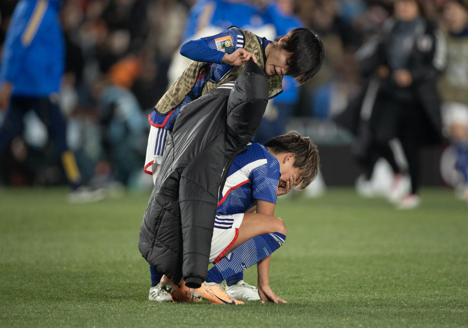 AUCKLAND, NEW ZEALAND - AUGUST 11: Moeka Minami of Japan is consoled by team mate after the FIFA Women's World Cup Australia & New Zealand 2023 Quarter Final match between Japan and Sweden at Eden Park on August 11, 2023 in Auckland, New Zealand. (Photo by Joe Prior/Visionhaus via Getty Images)