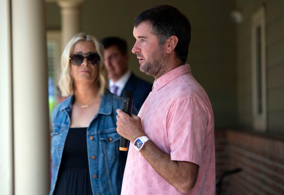Angie and Bubba Watson speak to the crowd Tuesday at a dedication of the Ronald McDonald House's renovated playground. The Watsons donated $106,000 for the project.
