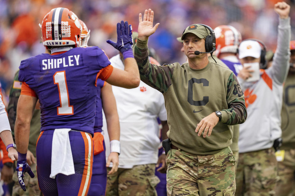 Clemson head coach Dabo Swinney congratulates running back Will Shipley (1) during the first half of an NCAA college football game against Georgia Tech, Saturday, Nov. 11, 2023, in Clemson, S.C. (AP Photo/Jacob Kupferman)