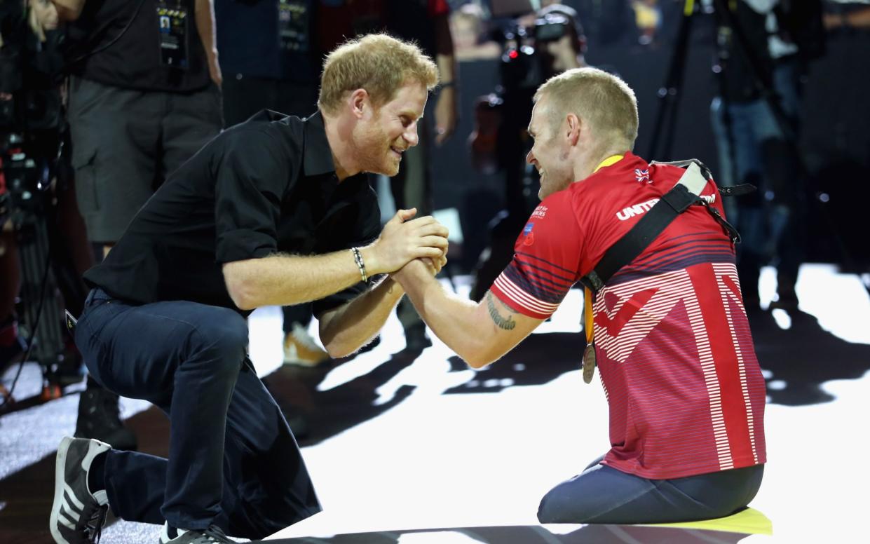 The Duke of Sussex greets Mark Ormrod at the indoor rowing competition at the Invictus Games in 2017