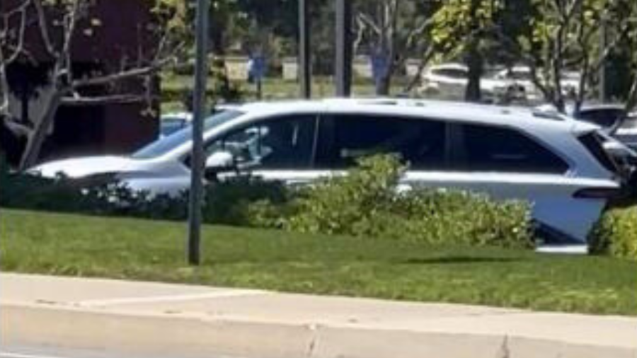 The suspect's newer model white Toyota Sienna minivan.