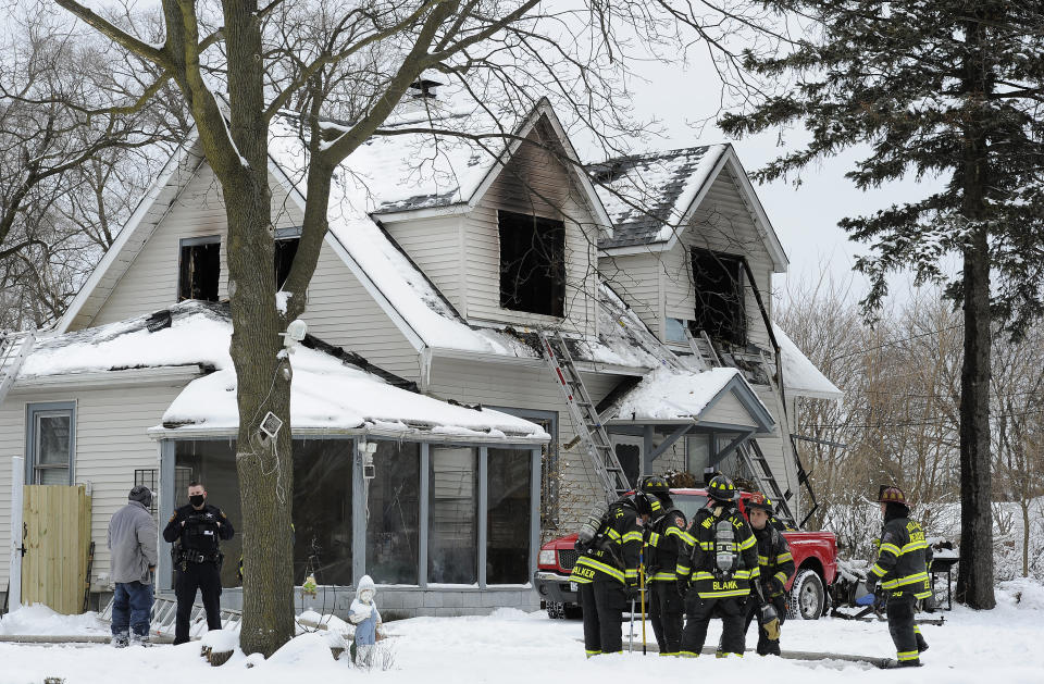 Firefighters work at the scene of a house fire on the 700 block of W. Oakton that claimed the lives of 5 people, Wednesday, Jan. 27, 2021, in Des Plaines, Ill. (Mark Welsh/Daily Herald via AP)