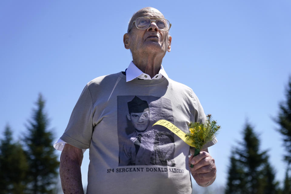 Clifton Sargent of South Portland, Maine, attends the unveiling of a monument to honor the military passengers of Flying Tiger Line Flight 739, Saturday, May 15, 2021, in Columbia Falls, Maine. Sargent's brother, SP4 Donald Sargent, was among those killed on the secret mission to Vietnam in 1962. (AP Photo/Robert F. Bukaty)