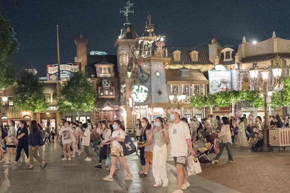 SHANGHAI, CHINA - JUNE 30: Tourists visit the Shanghai Disney Resort on the reopening day on June 30, 2022 in Shanghai, China. Shanghai Disney Resort reopened on Thursday after more than three months of closure due to the COVID-19 outbreak. (Photo by VCG/VCG via Getty Images)