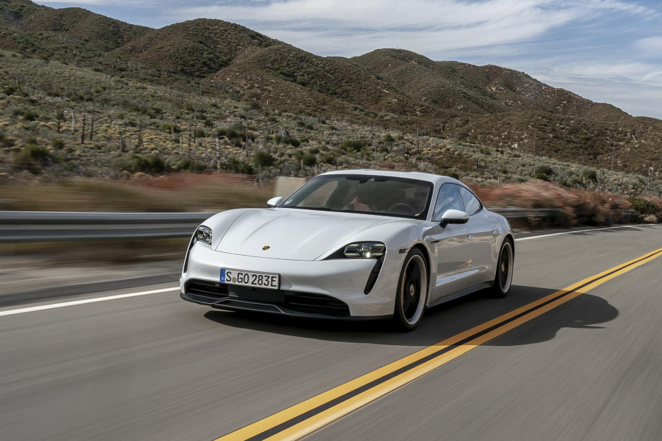 This undated photo provided by Porsche shows the 2020 Taycan. The Taycan is Porsche's first EV, and it's a multitalented one. You can use it just like a regular luxury sedan thanks to its four doors and two trunks, or you can drive it like a sports car and enjoy its rapid acceleration and hunkered-down handling. (Porsche Cars North America via AP)