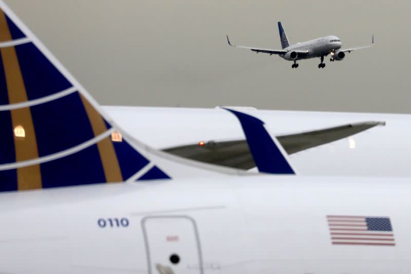 FILE PHOTO: FILE PHOTO: A United Airlines passenger jet lands at Newark Liberty International Airport