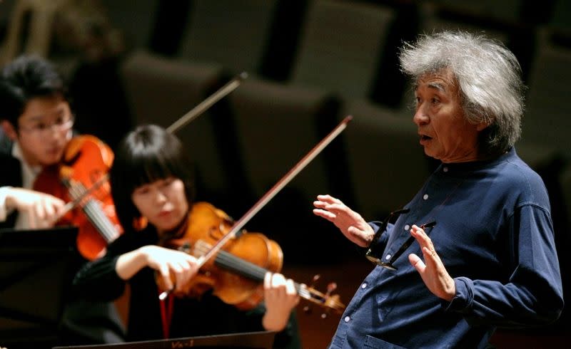 FILE PHOTO: Maestro Seiji Ozawa conducts the Seiji Ozawa Ongaku-juku orchestra during a rehearsal at the National Theatre in Beijing