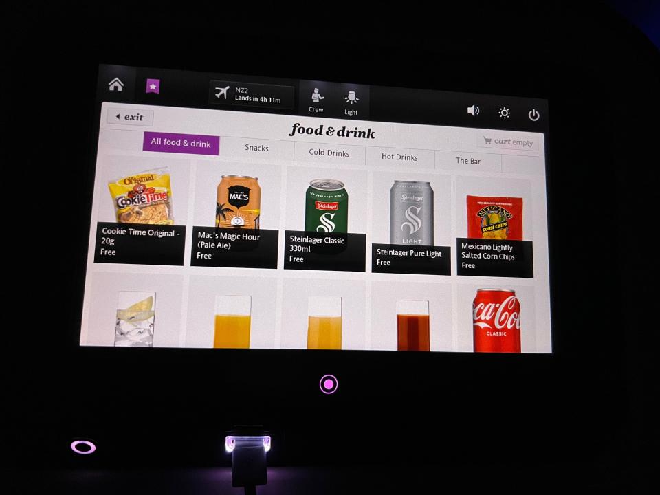 Seatback screen with drink options to order.