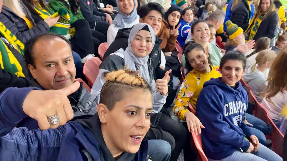 Members of the Afghan national women's team watched Australia take on Nigeria at Brisbane Stadium, on July 27, 2023. - Hilary Whiteman/CNN
