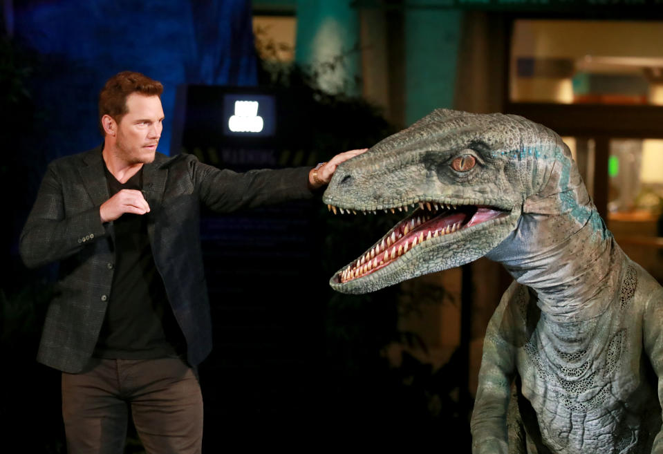 UNIVERSAL CITY, CALIFORNIA - JULY 22: Chris Pratt and Blue the velociraptor interact onstage at the grand opening celebration of 'Jurassic World -The Ride' at Universal Studios Hollywood on July 22, 2019 in Universal City, California. (Photo by Rich Fury/Getty Images for Universal Studios Hollywood )