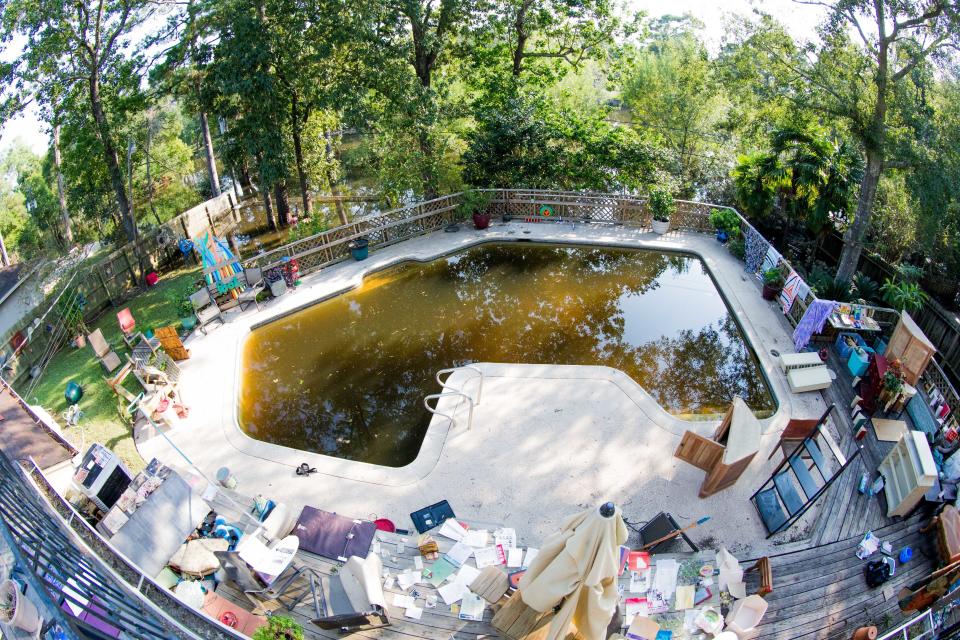 Books, furniture and other belongings are&nbsp;put outside to dry.