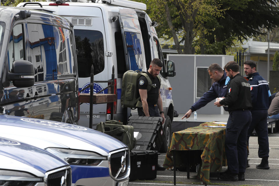 Frontex team members prepare their equipment during the official launch of the Frontex Joint Operation in North Macedonia, at police barracks in Skopje, North Macedonia, on Thursday, April 20. 2023. (AP Photo/Boris Grdanoski)