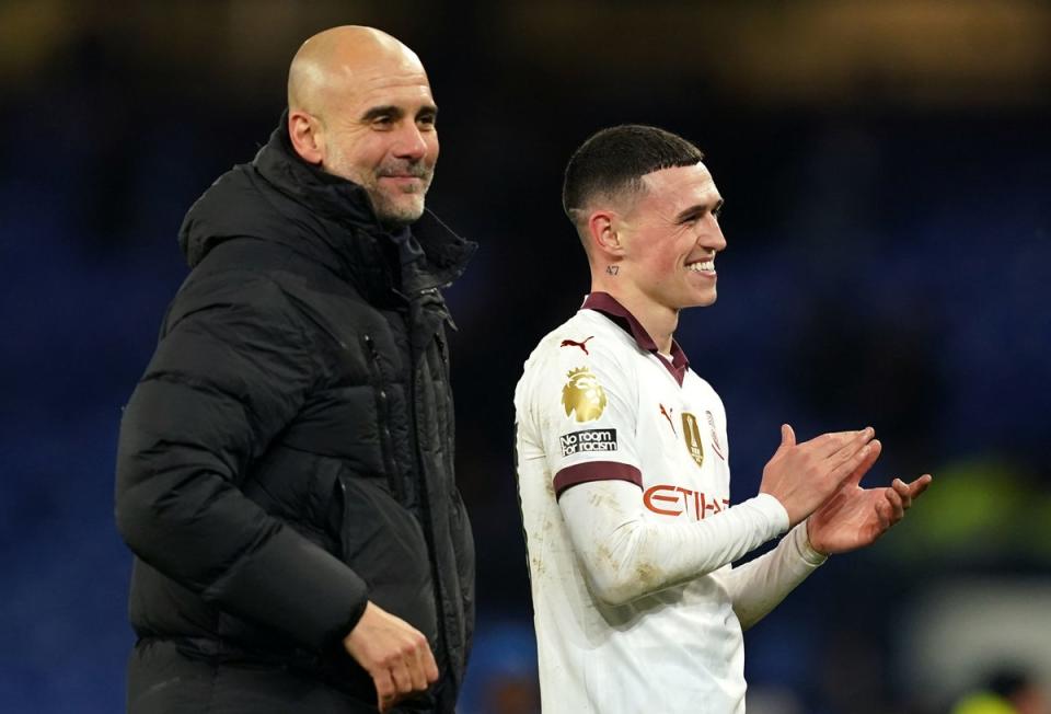City manager Pep Guardiola with young talent Phil Foden (PA)