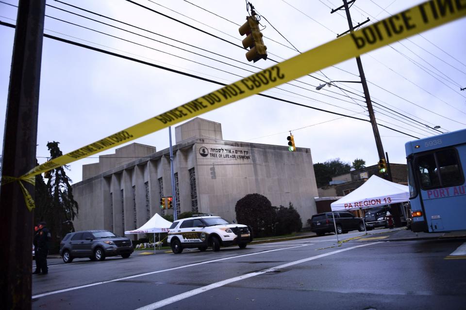 (FILES) Police tape surrounds the area outside the Tree of Life Synagogue in Pittsburgh, Pennsylvania, on October 28, 2018. Opening arguments are due on May 30, 2023, in the trial of an alleged gunman who killed 11 Jewish worshippers five years ago in the deadliest anti-Semitic attack in US history. Robert Bowers, 50, is accused of opening fire inside the Tree of Life synagogue in Pittsburgh, in the eastern state of Pennsylvania, on October 27, 2018. (Photo by Brendan Smialowski / AFP) (Photo by BRENDAN SMIALOWSKI/AFP via Getty Images) ORIG FILE ID: AFP_33GK4MQ.jpg