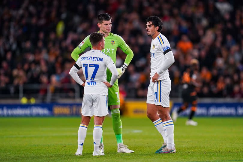 Leeds United goalkeeper Illan Meslier chats with midfielder Jamie Shackleton and defender Pascal Struijk during a stoppage in play