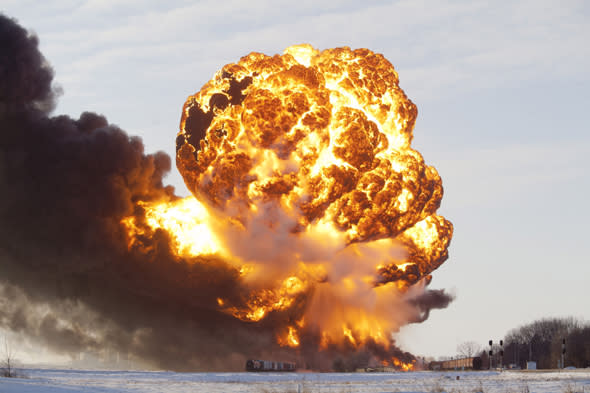 Mandatory Credit: Photo by ZUMA/REX (3452782b) A massive fireball from an exploding train car rises into the air just west of Casselton. Train collision ignites an oil tankers in North Dakota, America - 30 Dec 2013 The freight train was carrying 110 cars and went off the tracks west of Casselton and was hit by a second train. There were no reports of injuries from the accident. 