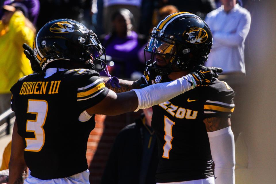 Missouri wide receivers Luther Burden III (3) and Theo Wease (1) celebrated a play during Missouri's game against LSU at Faurot Field on Oct. 7, 2023, in Columbia, Mo.