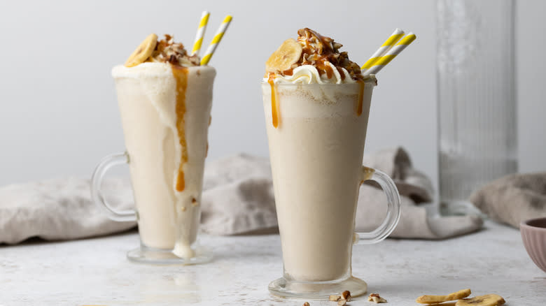 two banana caramel milkshakes