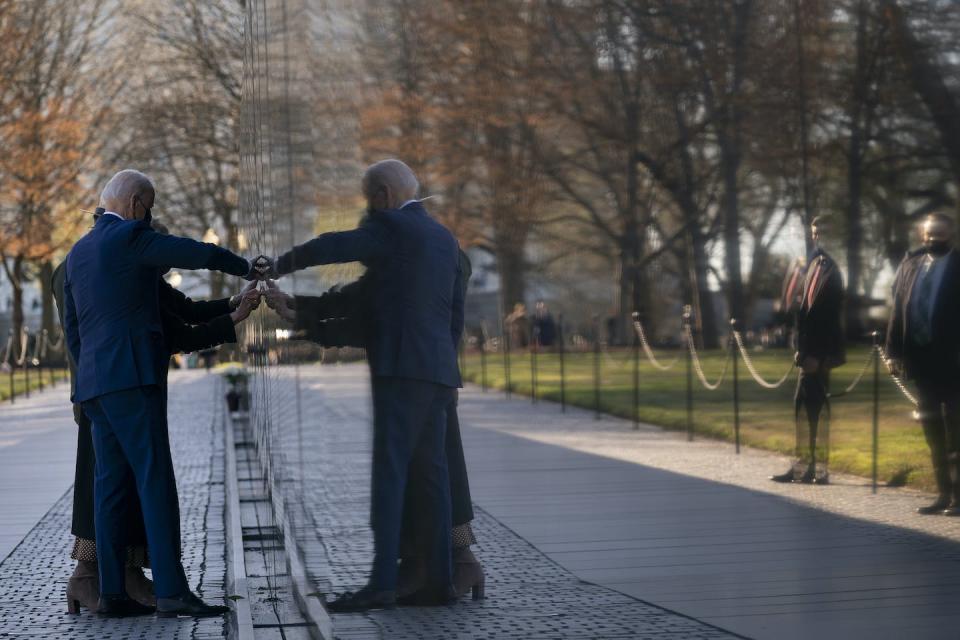 President Joe Biden and first lady Jill Biden visit the Vietnam Veterans Memorial to commemorate Vietnam War Veterans Day in March 2021. (AP Photo/Evan Vucci)