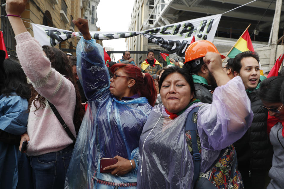 Opponents of Bolivia's President Evo Morales celebrate after he announced his resignation, in La Paz, Bolivia, Sunday, Nov. 10, 2019. (AP Photo/Juan Karita)