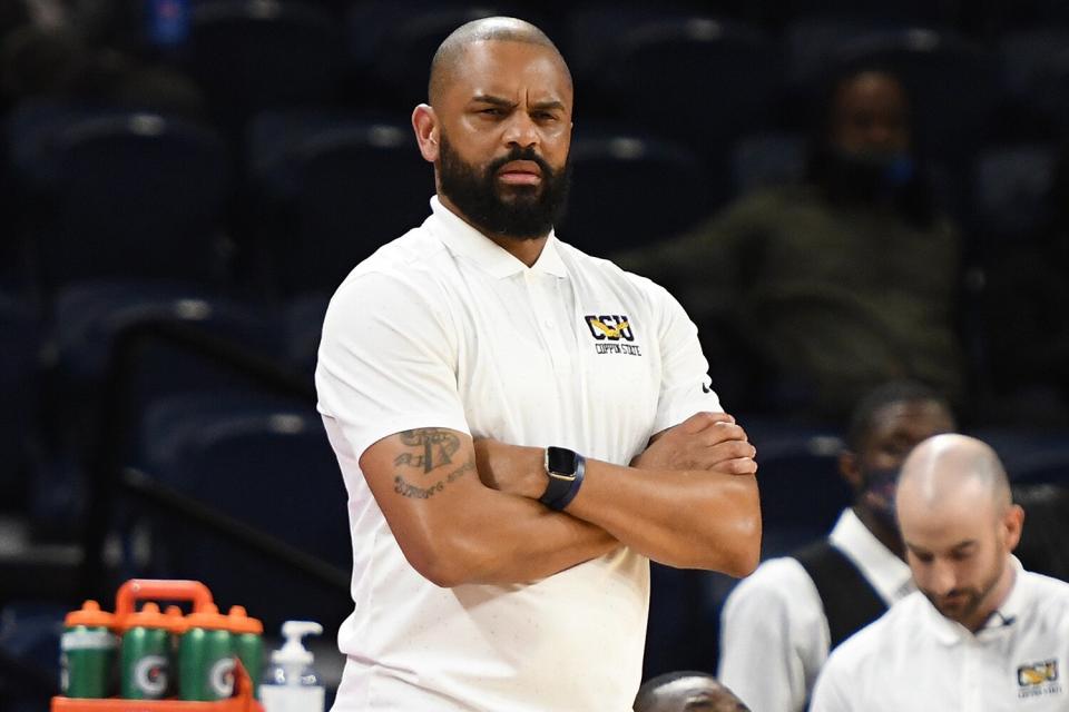 Head coach Juan Dixon of the Coppin State Eagles looks on during a college basketball game against the DePaul Blue Demons at Wintrust Arena on November 10, 2021 in Chicago, Illinois.