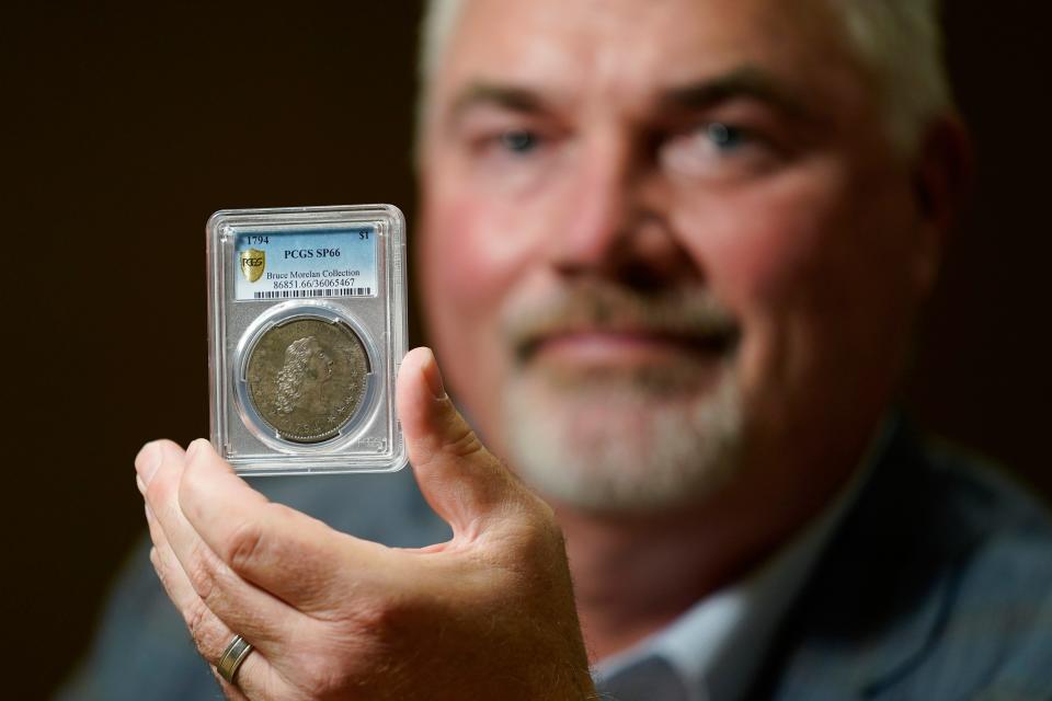 Las Vegas collector Bruce Morelan with the 1794 U.S. silver dollar that is said to be among the first ever minted.