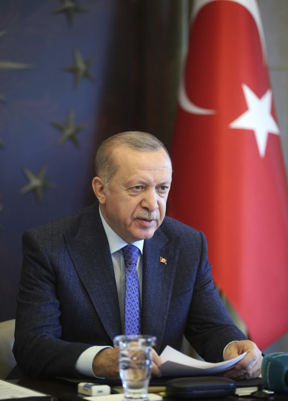 Turkish President Recep Tayyip Erdogan talks during a teleconference with his cabinet in Istanbul, Thursday, May 28, 2020. Turkey is relaxing several of the restrictions put into place to fight the coronavirus outbreak, as of June 1, including the lifting of the ban on travel between cities most affected by the coronavirus outbreak, while restaurants, cafe, museums, sports centers, parks and beaches will re-open. (Mustafa Kamaci/Presidential Press Service via AP, Pool)