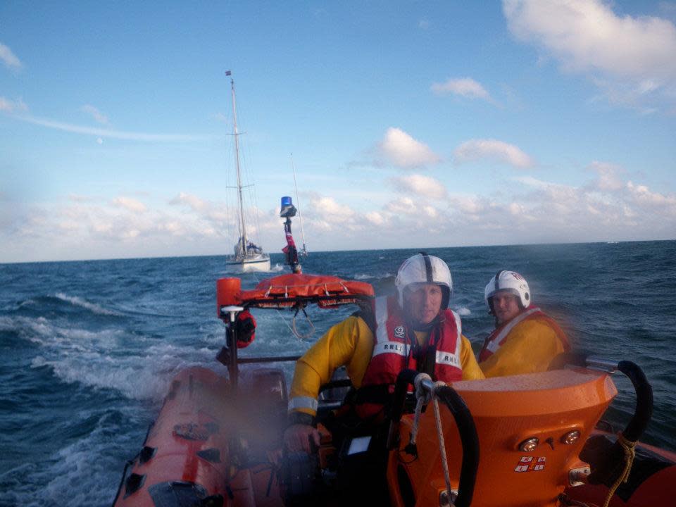 Andy Harris at the helm of the Blue Peter 1 towing a yacht back to harbour in June 2012 (RNLI/PA)