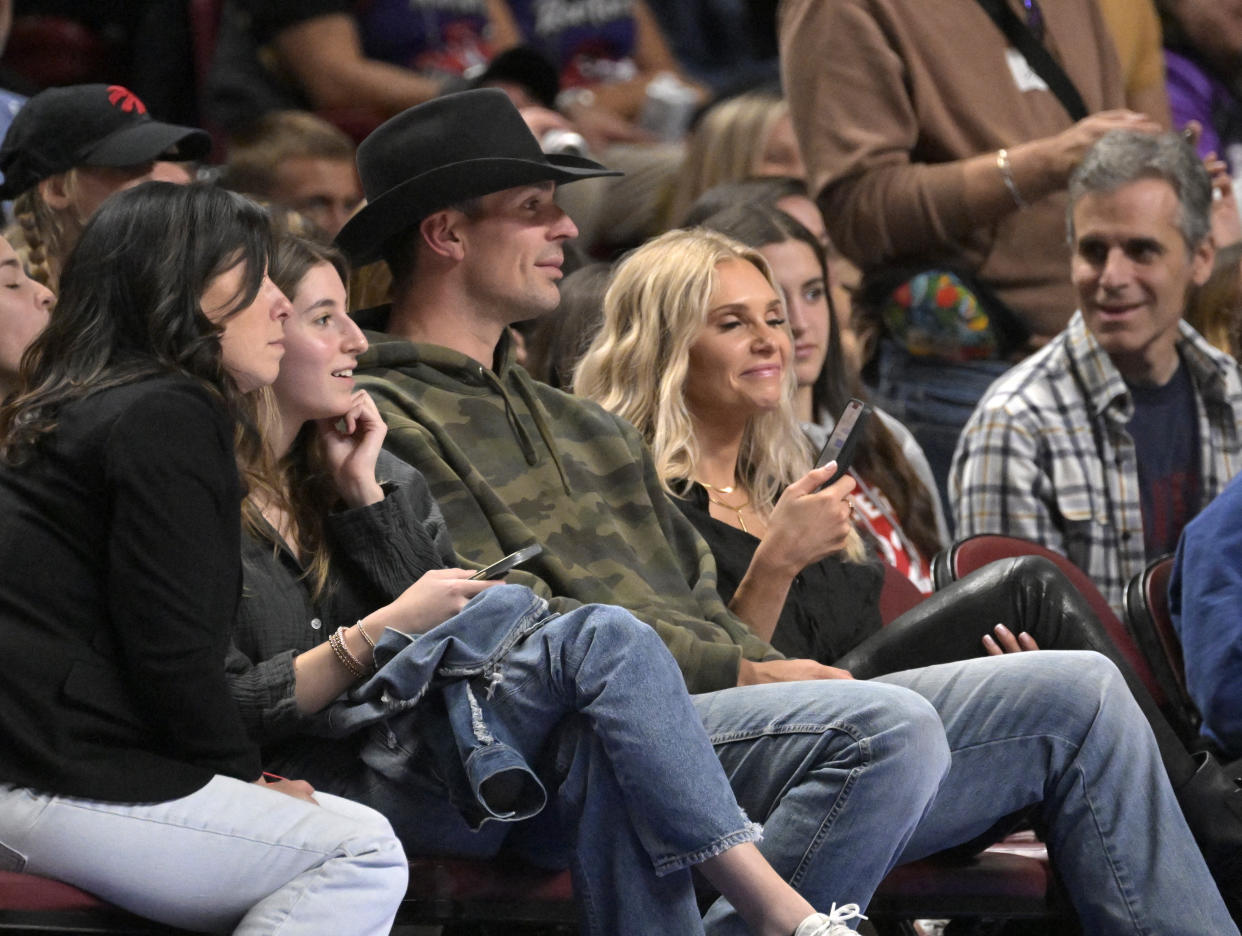 Oct 14, 2022; Montreal, Quebec, CAN; Montreal Canadiens goalie Carey Price (in cowboy hat) and his wife Angela (right) watch the second quarter of the game between the Boston Celtics and the Toronto Raptors at the Bell Centre. Mandatory Credit: Eric Bolte-USA TODAY Sports