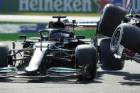 Mercedes driver Lewis Hamilton of Britain crashes with Red Bull driver Max Verstappen of the Netherlands during the Italian Formula One Grand Prix, at Monza racetrack, in Monza, Italy, Sunday, Sept.12, 2021. (AP Photo/Luca Bruno)